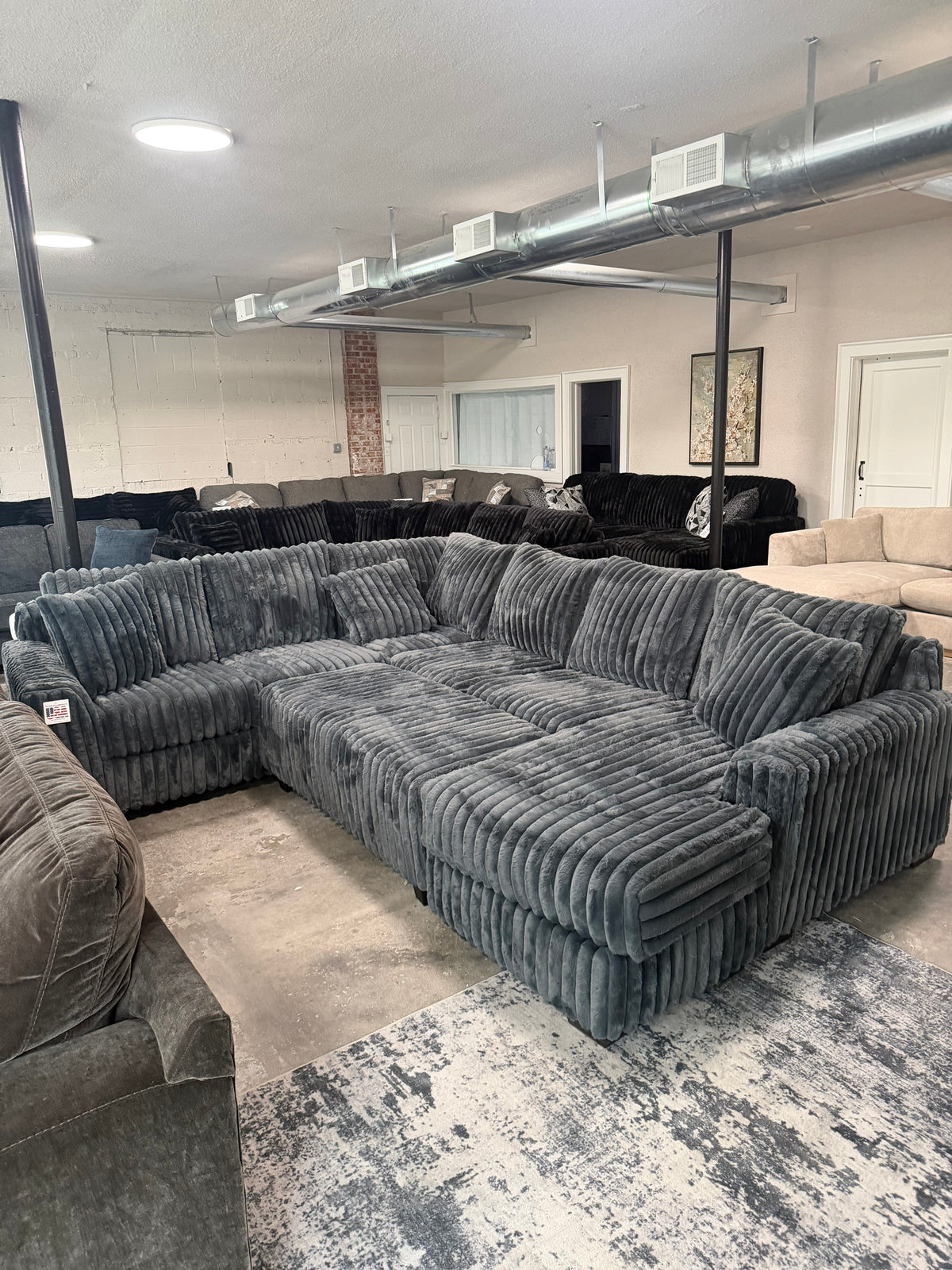 Joshua, owner of Sofa Savers, in the Chesapeake showroom